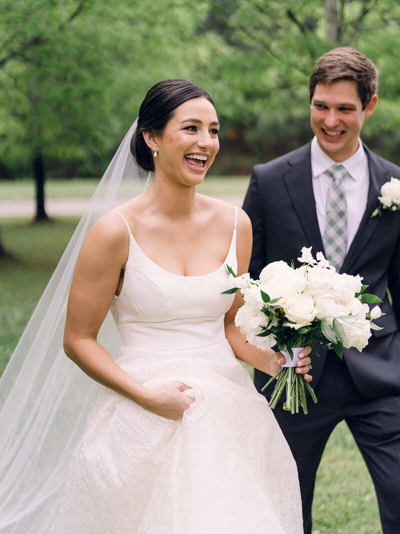 Husband and wife stand together after getting married in ATL