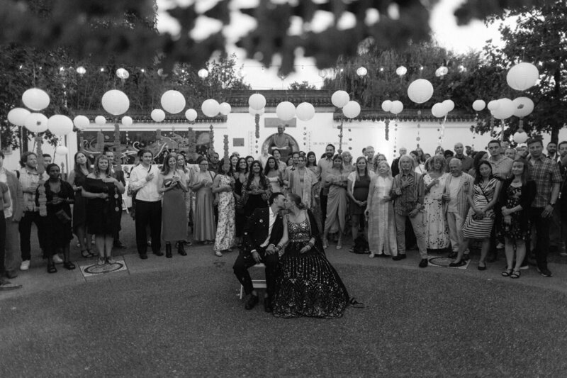 couple kissing during wedding reception at sun yat-sen garden in vancouver