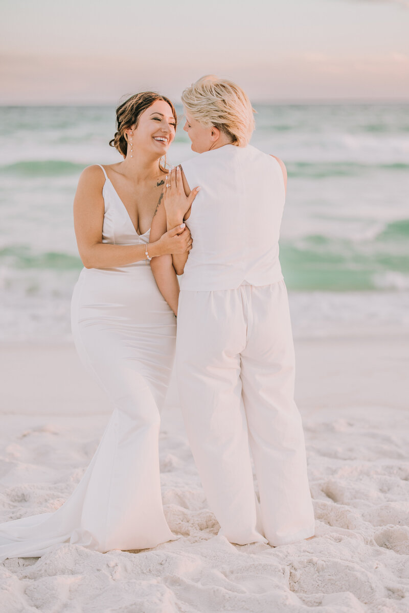 Beautiful couples portrait after their wedding on the beach along the Florida Gulf Coast.