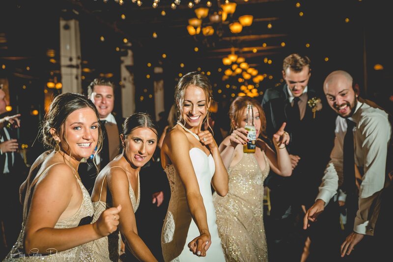 bride and guests dancing and smiling