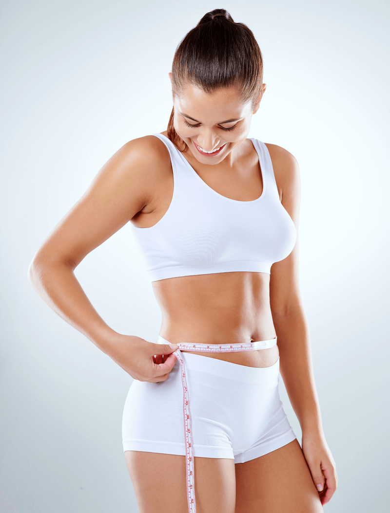 woman with tape measure around waist