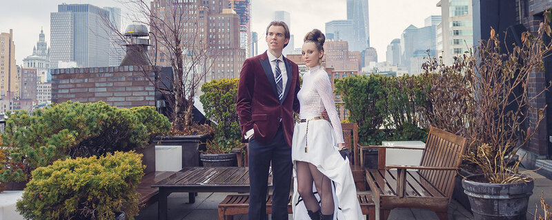 Bride and groom standing on rooftop in NYC