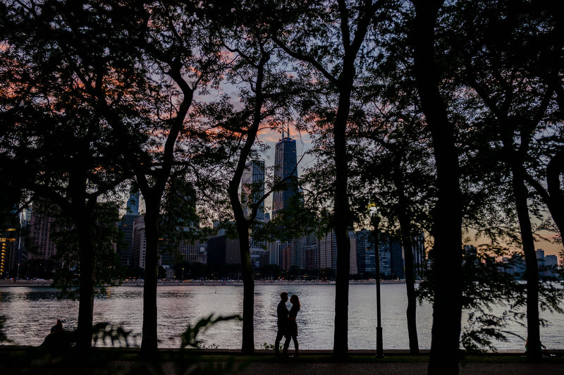 Couple embrace at sunset at Milton Lee Olive Park during engagement session by Sarah Nader Photography
