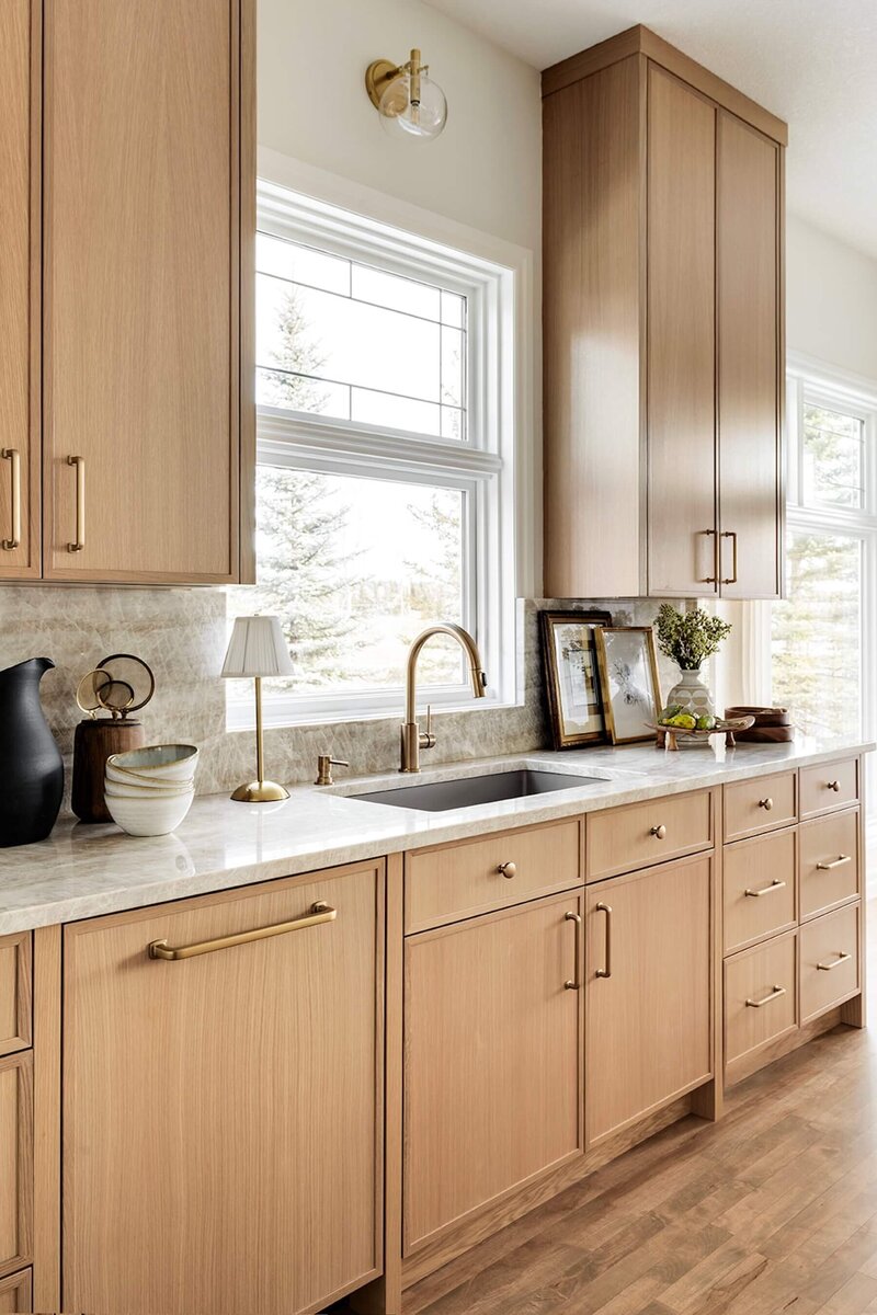 Kitchen renovation with quartzite and skinny shake white oak cabinets. 