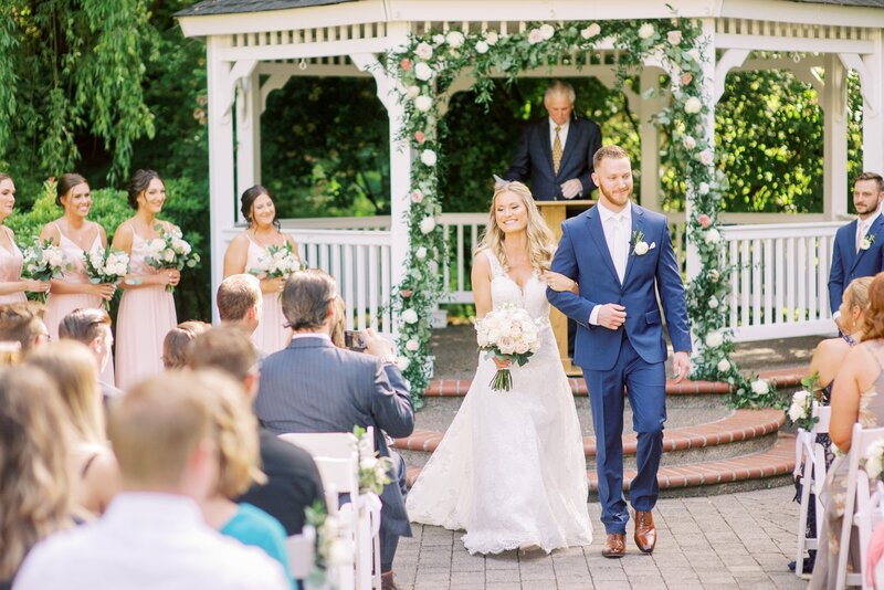 Bride and Groom exiting the aisle at Abernethy Center.