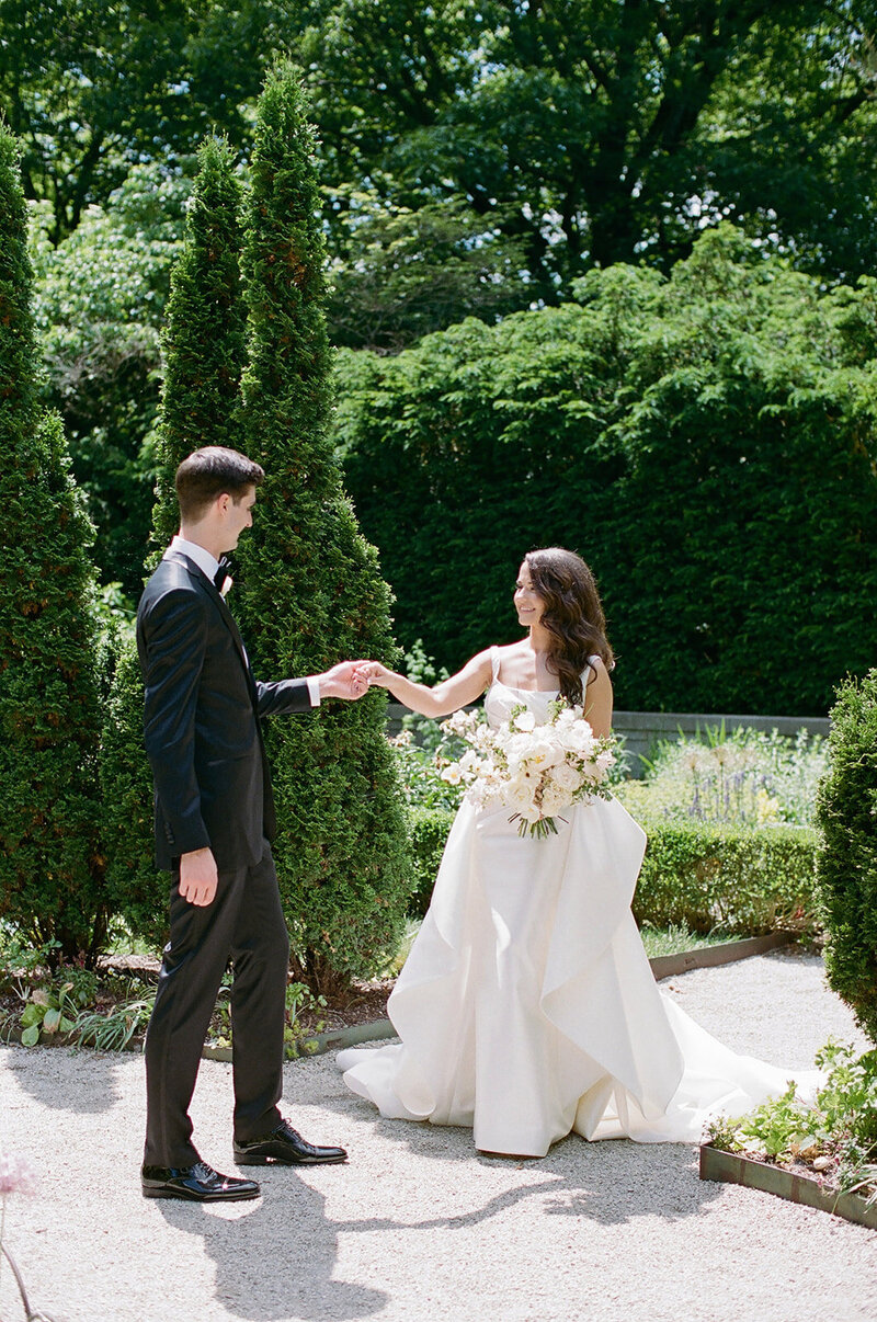 bride and groom holding hands