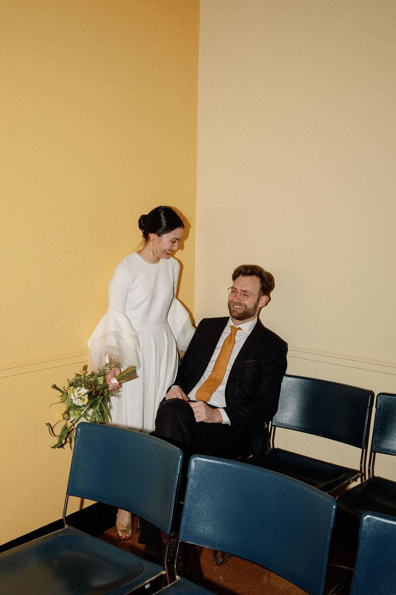 Brooklyn city hall couple with bell sleeves and bouquet