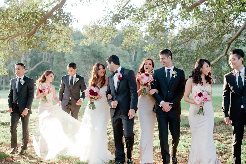 Joyful bridal party captured in golden light in Centennial Park, Sydney
