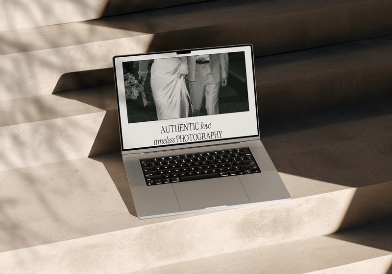Laptop on table of photographer website