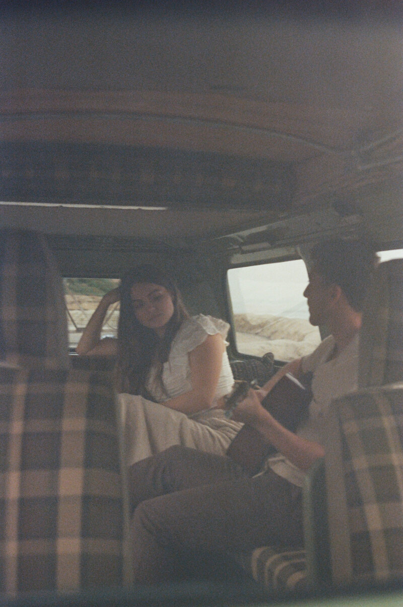 a couple sitting in a van