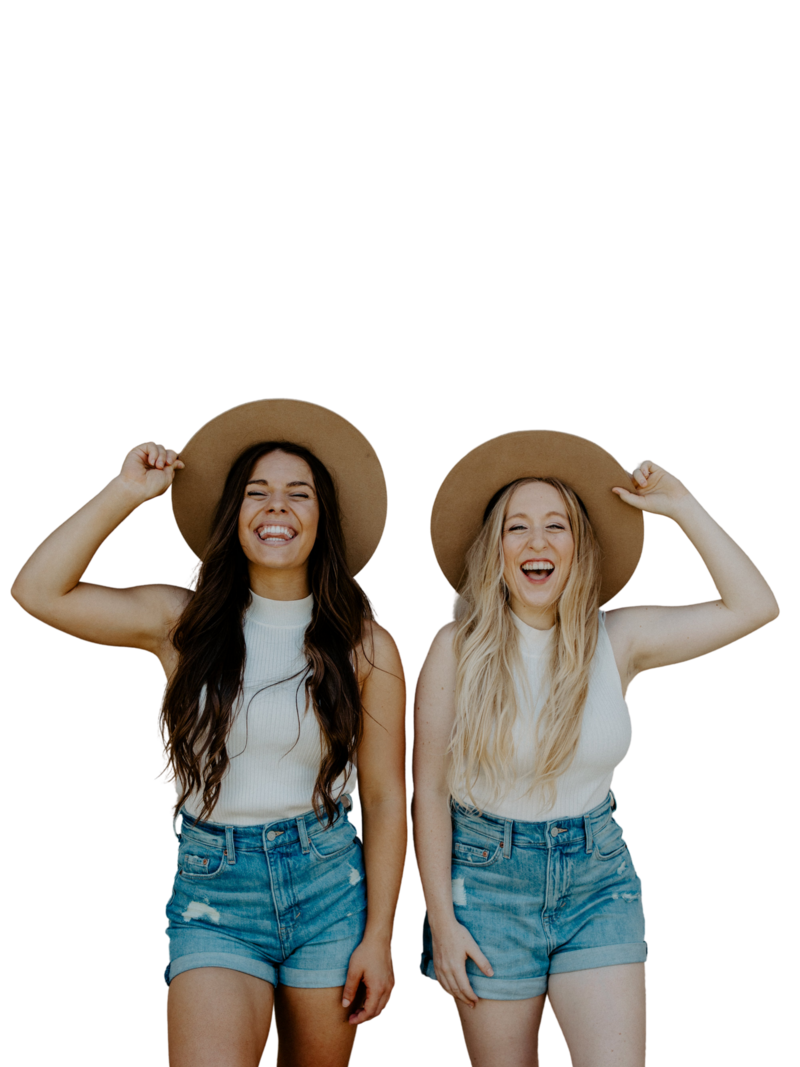 girls smiling wearing hats