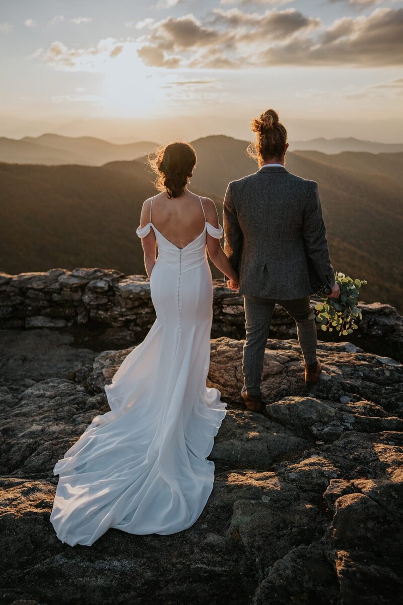 Couple looking out into the mountains after their elopement