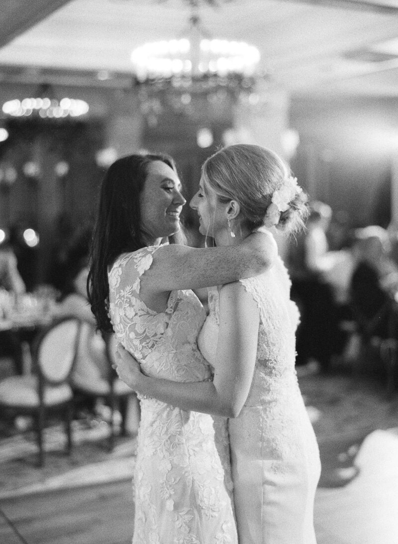 Two brides dancing at Rancho Valencia wedding reception - Jacqueline Benét