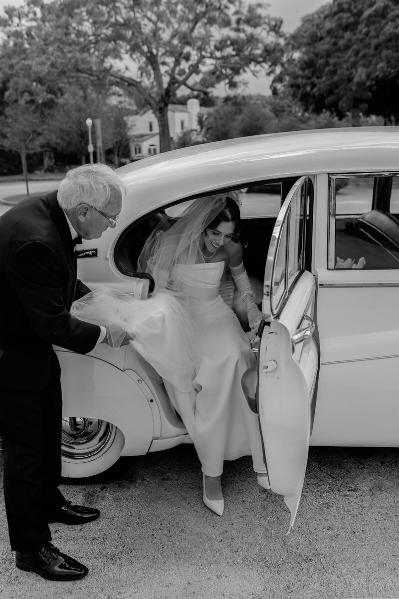 Bride getting out of car