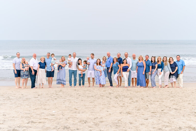 Wedding couple laughing during ceremony on the pier in Kitty Hawk, NC