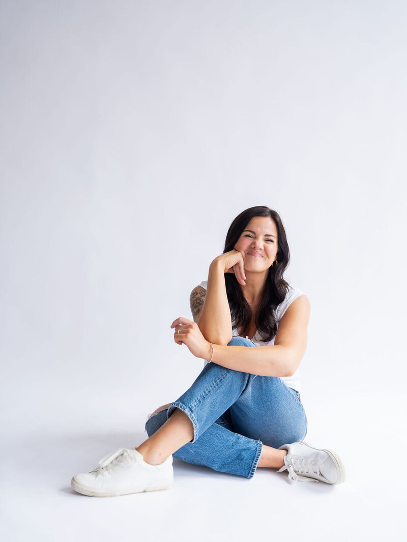 Happy girl woman sitting on the floor