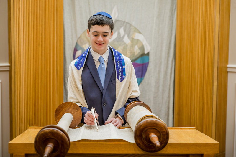 Bar Mitzvah boy reads from the Torah at a Synagogue in NJ.