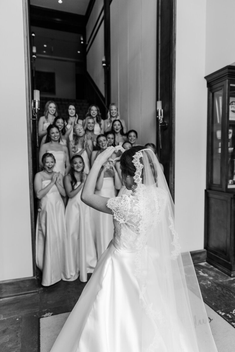 Bride in front of a window at Chateau de Champlatreux