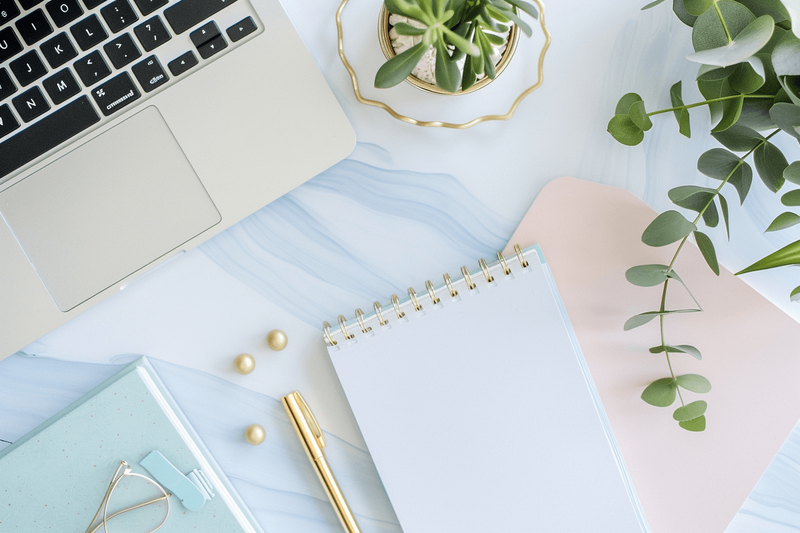 Blue and white marble desk with notebooks