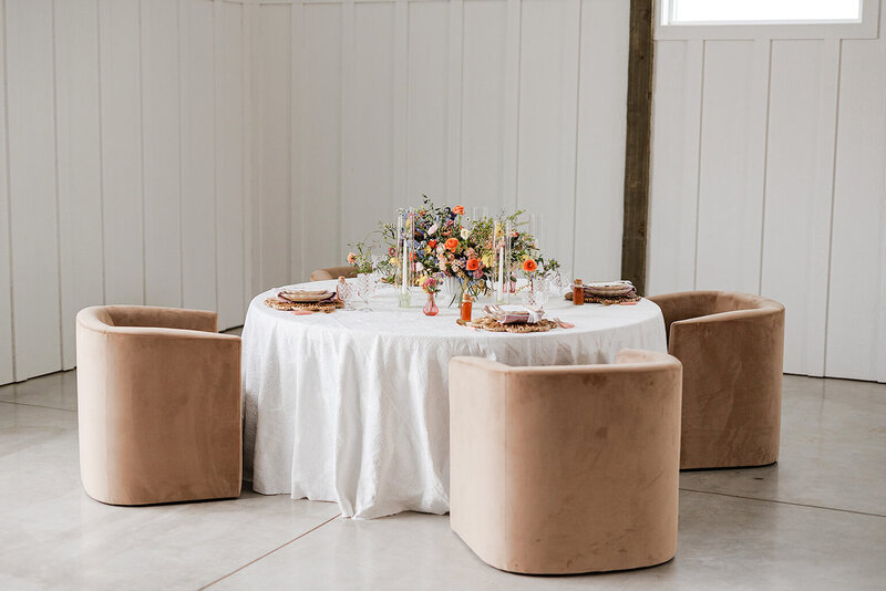 An even fancier and more chic reception table with some very fancy chairs.