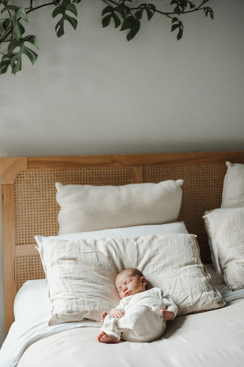 Melbourne in-home newborn photographer - baby lying on bed 