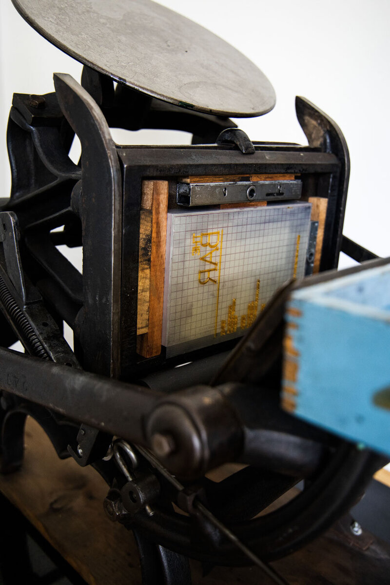 Vintage printing press with a letterpress plate