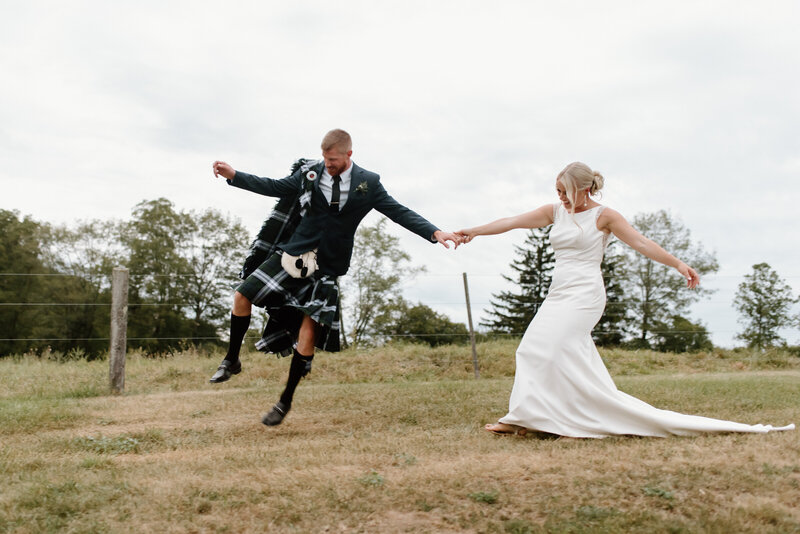 hamilton ontario wedding couple leaping for joy