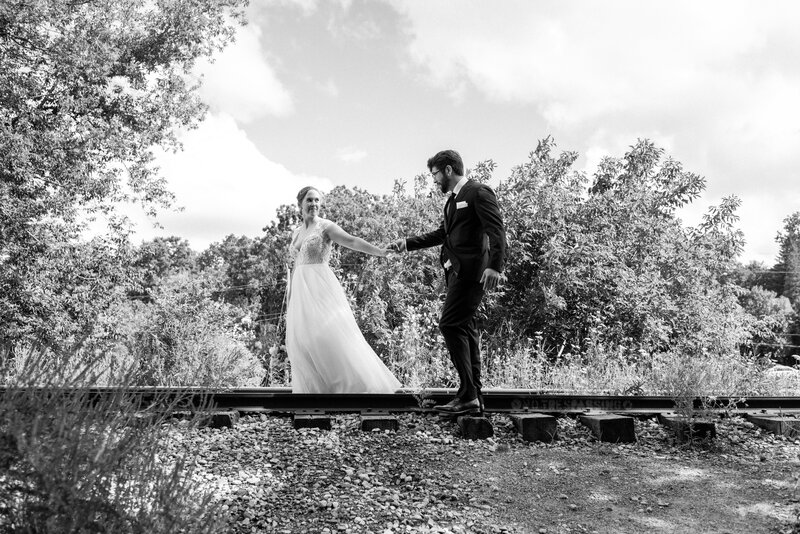 Cambridge, Ontario bride and groom walking on train tracks