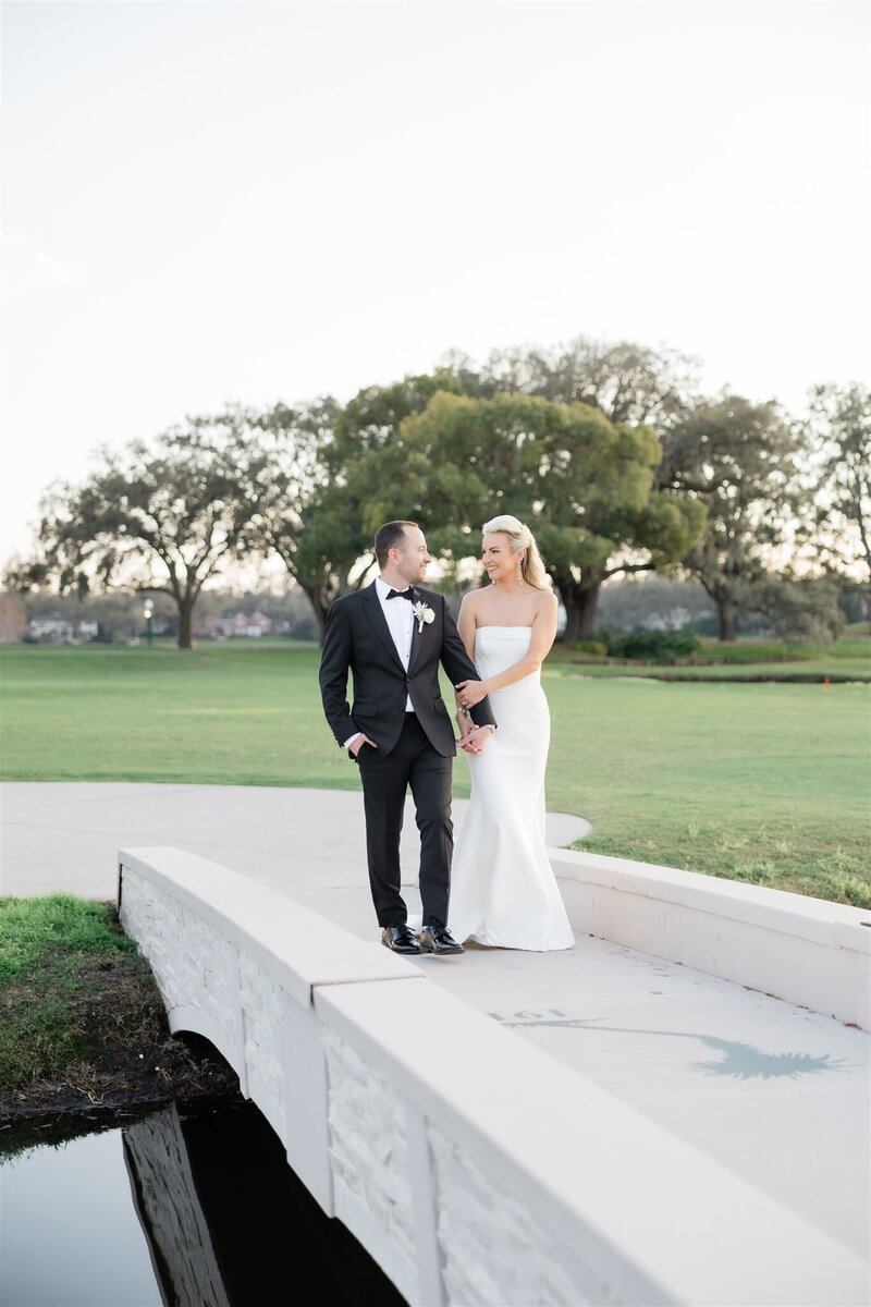 Bride and Groom Portrait on a golf course at the Country Club of Orlando by Orlando wedding photographer