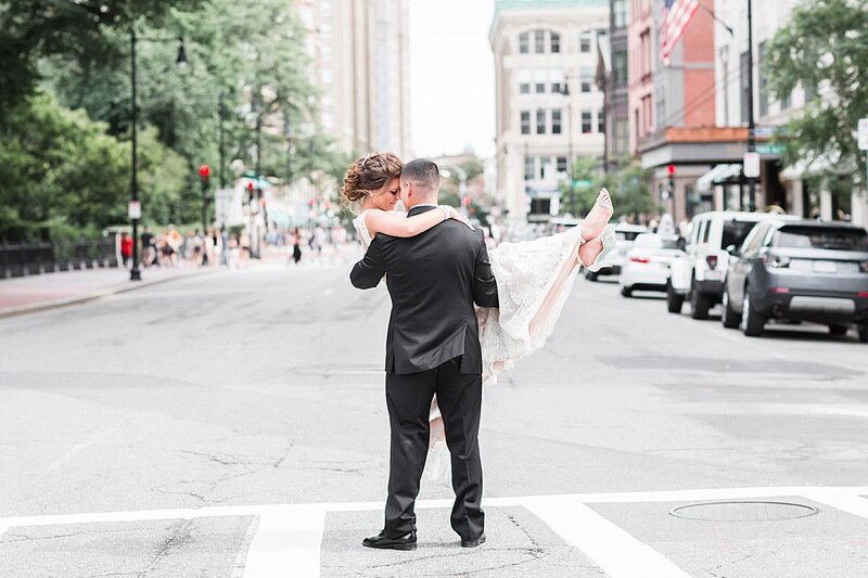 Groom holding Bride in the middle of the Boston street