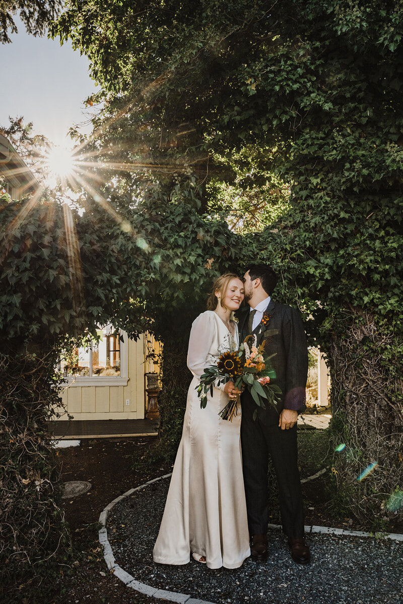 Newlyweds  kissing at salt spring island  wedding