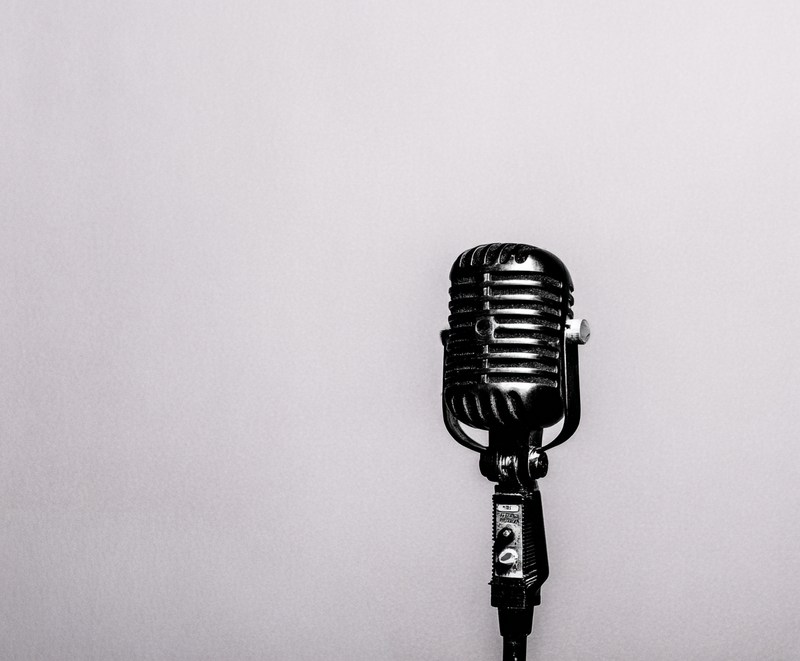 Vintage black microphone on soft background symbolizing brand voice, emotional tone, and message clarity for creative leaders and founders