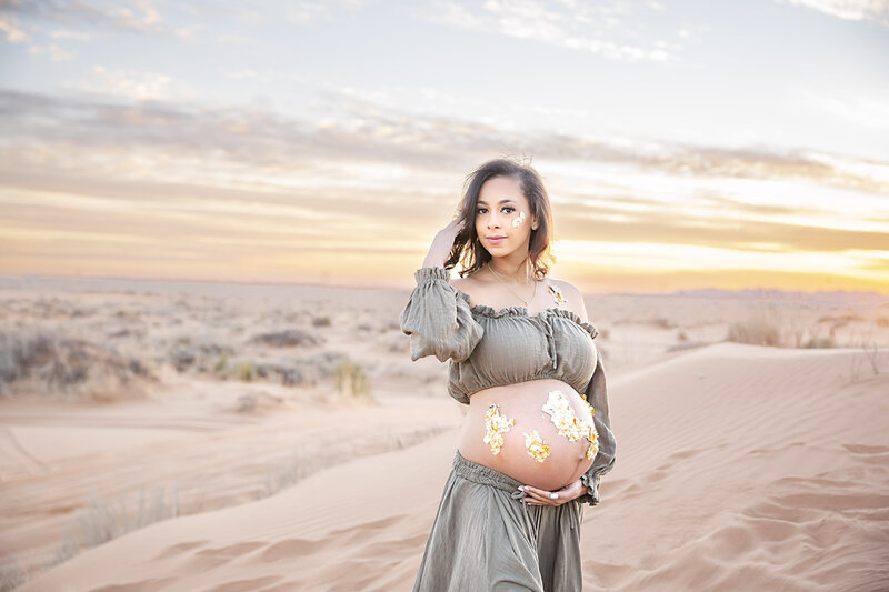 Pregnant woman poses during sunset