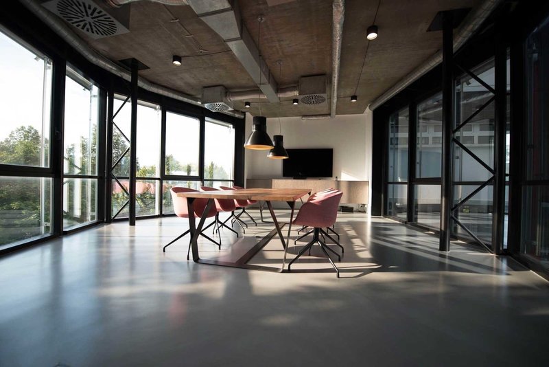 Open plan meeting space with sofas and tables