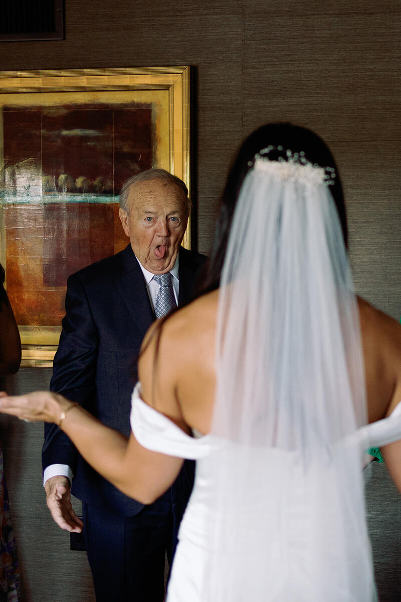 Bride having a first look with her grandfather at her wedding