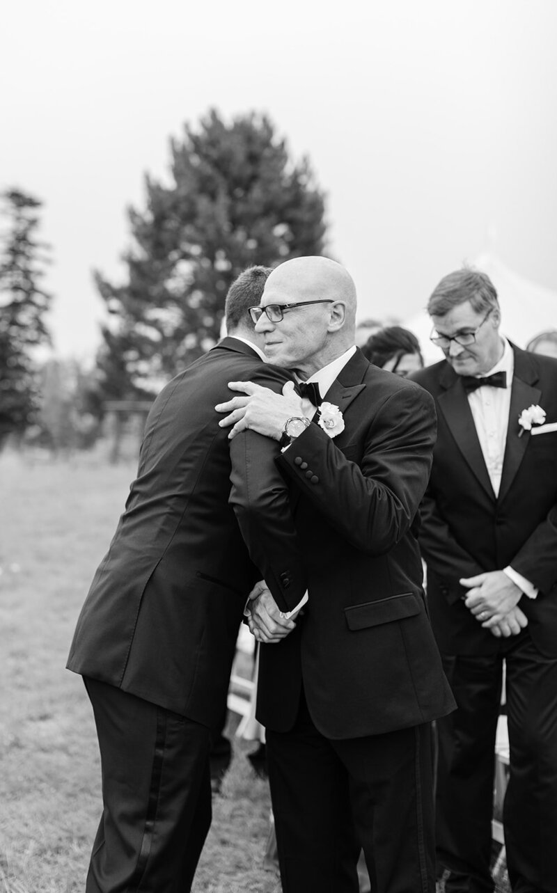 brides-father-hugging-groom-ceremony