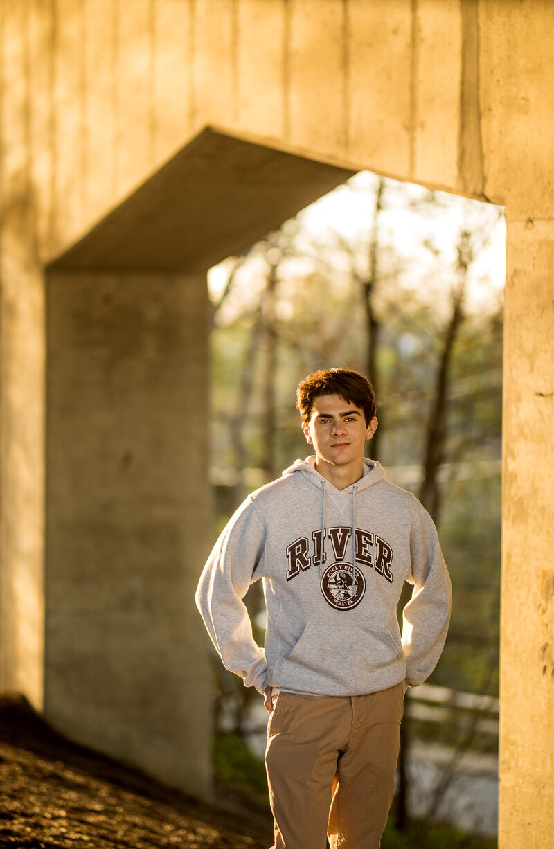 A senior boy from Rocky River smiles for his senior portrait.