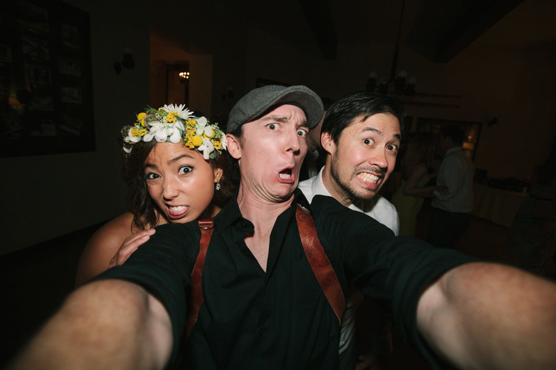 Photographer selfie with bride and groom