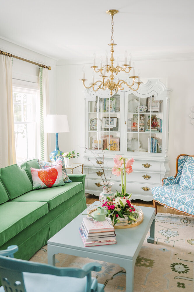 parlor room with green, piink, blie, and white color scheme
