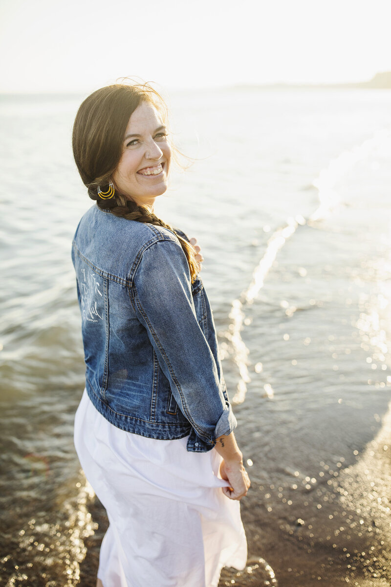 Sandra Henderson, wedding photography educator and systems strategist, smiles at the camera. Photo is used 
