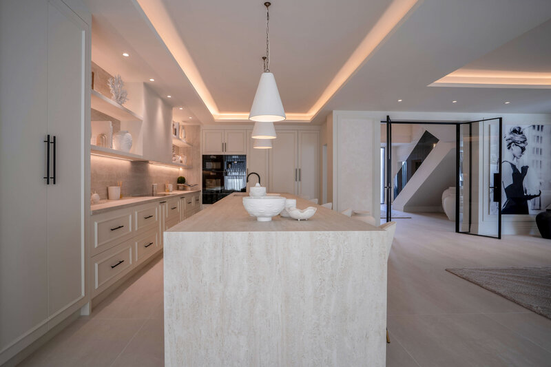 neutral toned kitchen with large island and barstool seating