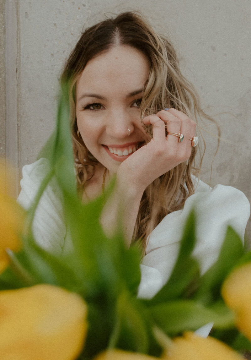 woman posing with flowers