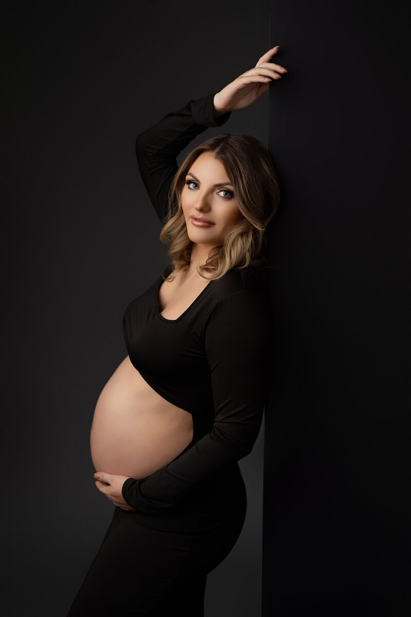 Pregnant woman posing for maternity photoshoot in phoenix