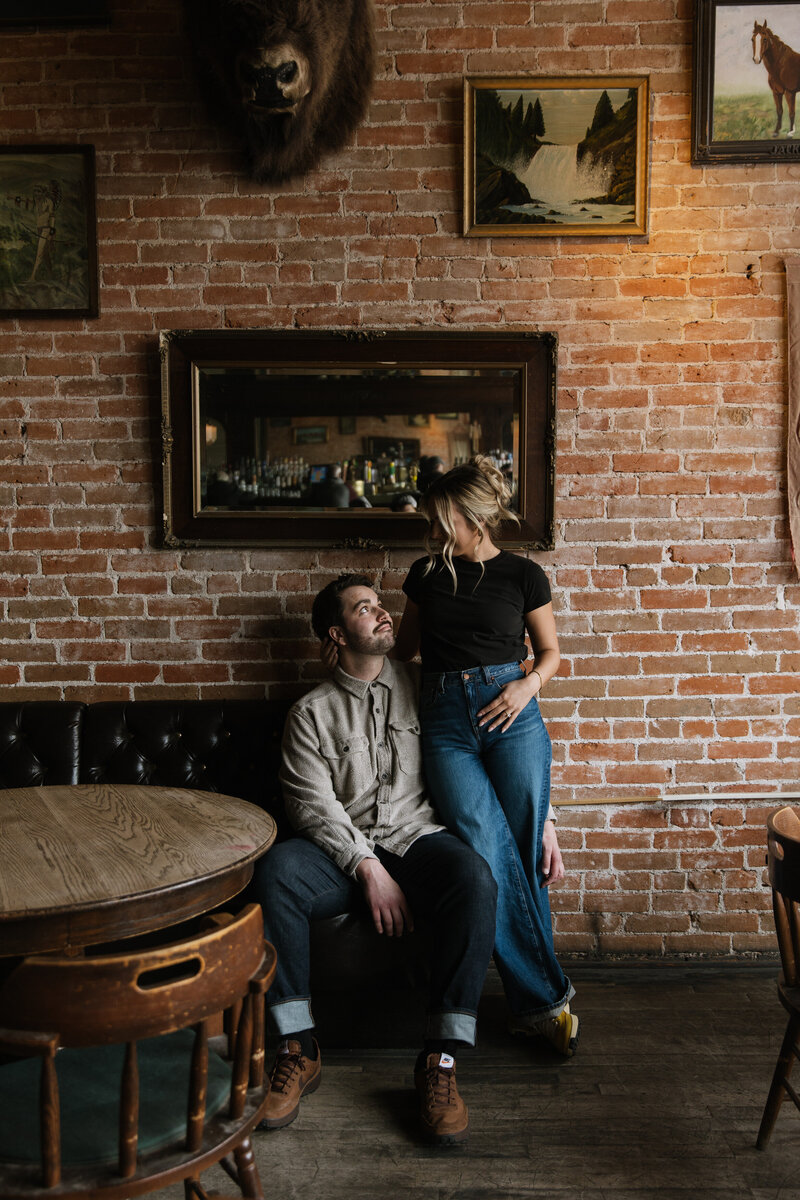 Vintage style engagement photo session inside Pengilly Saloon in Downtown Boise