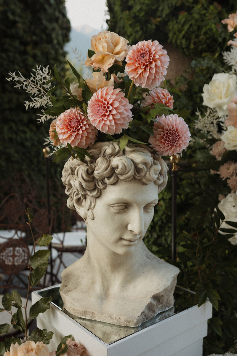 Wedding photographer captures couple taking a stroll hand in hand at their french chateau wedding.
