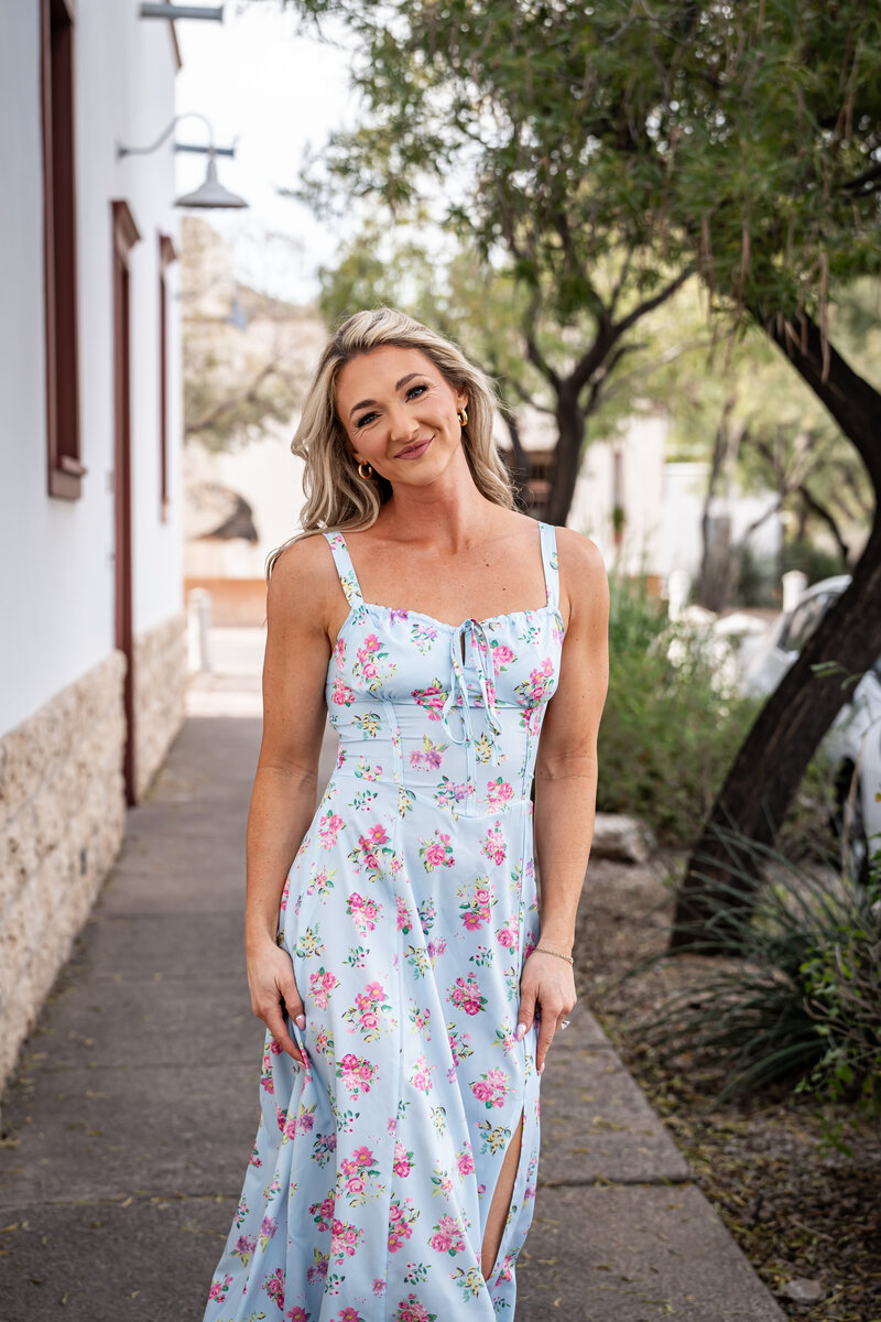 Zoe Schroeder, registered dietitian and fitness coach, smiling in workout gear, ready to guide clients through personalized fitness and nutrition programs.