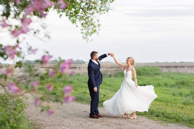 Bride and Groom in Front of Red Door