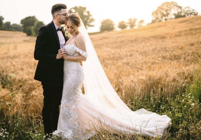 Bride and groom in the field at Iscoyd