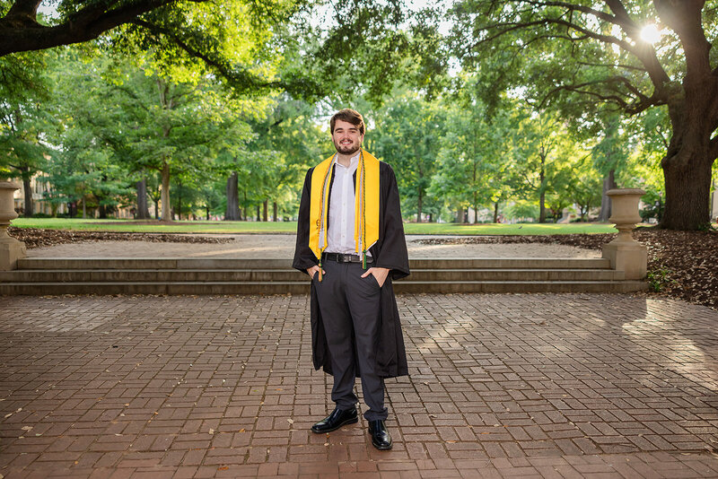 A University of South Carolina student taking his senior portraits on campus