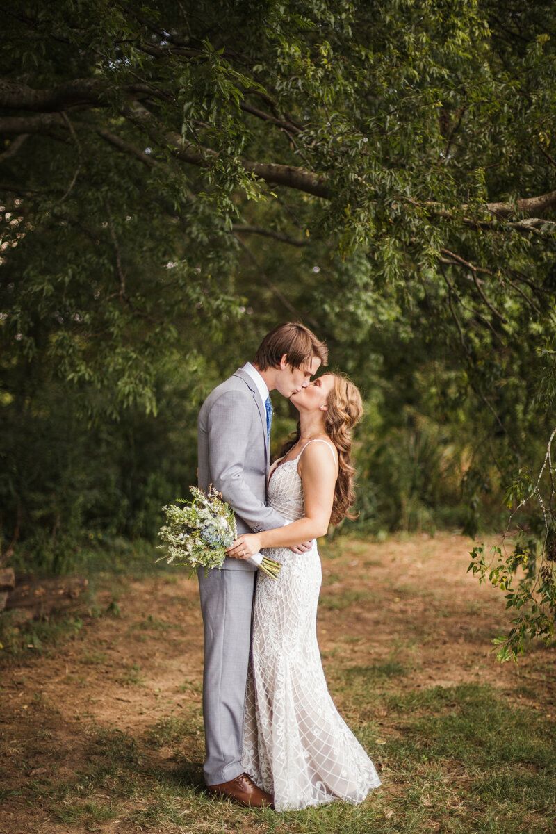 bride and groom kissing during bridals